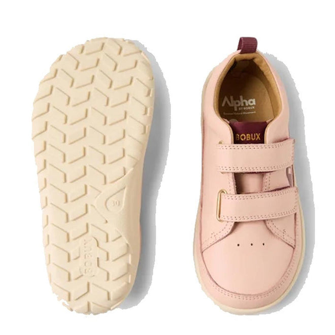The Bobux Kid+ Dawn Leather Sneaker Cameo Rose Pink Alpha is shown with one shoe displaying the barefoot-shaped toe-box and branding, and the other flipped to highlight its textured cream-colored sole. Both feature two Velcro straps., 9420068565647, 9420068565654, 9420068565661, 9420068565678, 9420068565685, 9420068565692, 9420068565708