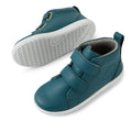 The Bobux KP Grass Court High II Boot Mediterranean Green Juniors are kids’ teal leather high-top sneakers with white rubber soles, two adjustable straps, and a back loop for easy pull-on. One shoe is upright, the other shows the sole pattern., 9420074859099, 9420074859105, 9420074859112, 9420074859129, 9420074859136, 9420074859143, 9420074859150