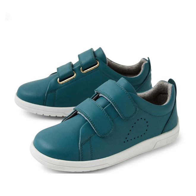 The Bobux KP Kids Plus Grass Court 2 II Leather Sneaker in Mediterranean Green features white durable soles and two adjustable Velcro straps per shoe, shown on a white background.