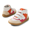 The Bobux KP Kids Plus Harley Ankle Leather Boot in Radiant Raspberry for juniors features white, tan, orange, and pink panels, perforated toes, adjustable straps, and a durable gum sole, shown against a white background.