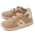 Bobux KP Kids Plus Titan Juniors Leather Sneaker in Warm Taupe features adjustable hook-and-loop straps, perforated sides, a cushioned collar, and a slip-resistant sole. Displayed on a white background.