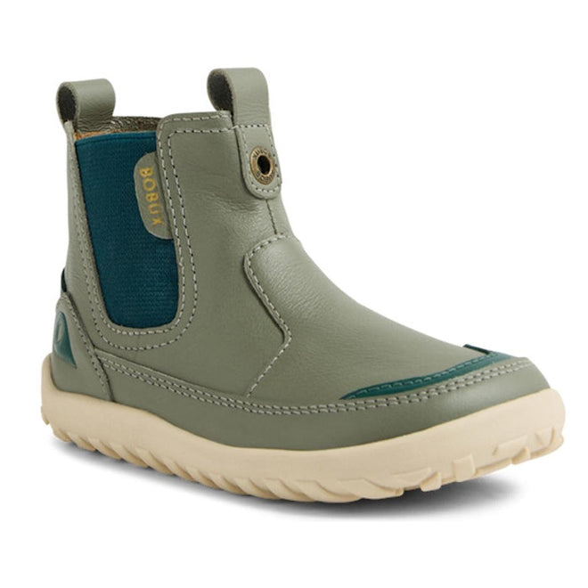 The Bobux KP Kids Plus Trail Leather Boot Juniors Vetiver Green Alpha is a sage green kids’ leather boot with a cream zero-drop sole, blue elastic side panel, barefoot toe-box, pull tabs, visible stitching, and yellow BOBUX branding., 9420074824219, 9420074824226, 9420074824233, 9420074824240, 9420074824257, 9420074824264, 9420074824271