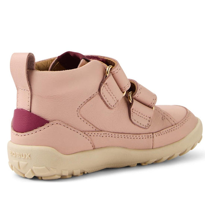 The Bobux KP Kids Plus Trek Leather Boot Juniors Cameo Rose Pink Alpha features a barefoot-shaped toebox, two velcro straps, beige rubber sole, and maroon heel accent, shown from the side and slightly behind., 9420068563346, 9420068563353, 9420068563360, 9420068563377, 9420068563384, 9420068563391, 9420068563407