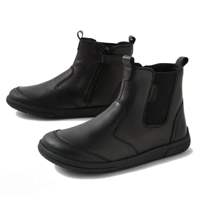 The Bobux Kid+ Black School Leather Boot Jodhpur II Black Sole Junior features black leather, side zippers, pull tabs, elastic panels, and sturdy rubber soles, shown against a white background., 51128, 51129, 51130, 51131, 51132, 51133, 51134, 51128, 9420074842091, 51130, 9420074842114, 9420074842121, 9420074842138, 9420074842145