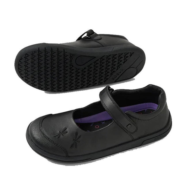 The Bobux Kid+ Skipper Black School Leather Mary Jane Shoe features a Velcro strap, embossed dragonfly design on the toe, a purple insole, and a patterned sole; one shoe stands upright while the other lies on its side., 9420074842572, 9420074842589, 9420074842596, 9420074842602, 9420074842619, 9420074842626, 9420074842633