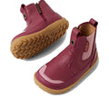 Two Bobux SU Step Up Trail Leather Boots in Beaujolias Purple with light brown rubber soles, side zippers, stretchy panels, and a barefoot-shaped toe-box—perfect for first walkers. The Bobux branding appears on one boot., 9420068578340, 9420068578357, 9420068578364