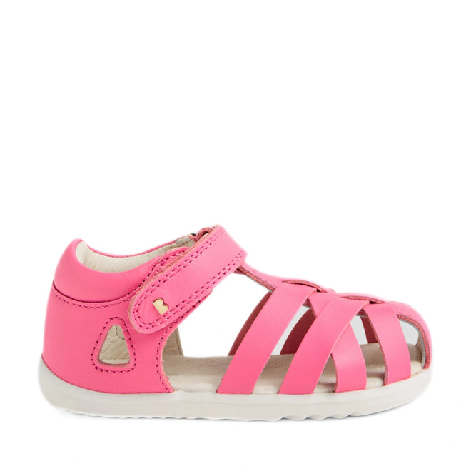 The Bobux Step Up SU Tropicana II Pink Lemonade Closed Toe Sandal for toddlers, featuring a Velcro strap, white sole, and cut-out side details reminiscent of the classic Tropicana style, is displayed against a white background., 9420074809902, 9420074809919, 9420074809926