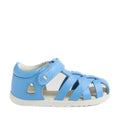 The Bobux Step Up SU Tropicana II Baltic Sea Blue Closed Toe Sandal is a blue toddler sandal inspired by the iconic Bobux Tropicana design. It features a closed heel, open toe, and crisscross straps, along with a Velcro strap and a small heart detail near the ankle. Like many toddler leather sandals, it has a white, flat sole., 9420074809957, 9420074809964, 9420074809971