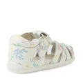 The Bobux Step Up SU Tropicana II White Floral Closed Toe Sandal is a white leather toddler sandal inspired by the Bobux Tropicana, featuring pastel floral patterns, a closed heel, open toe design, and a secure buckle strap. With soft, flexible soles and cut-out details on the sides, this charming closed-toe sandal provides all-day comfort for little feet., 9420074810007, 9420074810014, 9420074810021