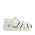 Bobux Step Up SU Tropicana II White Floral Closed Toe Sandal for toddlers, inspired by the classic Bobux Tropicana, features a Velcro strap and a closed toe with open sides. Crafted from high-quality leather, it showcases a pastel floral pattern with stars, leaves, and mushrooms in blue, purple, and yellow. The sandal is finished with a lightly textured white sole for a clean look., 9420074810007, 9420074810014, 9420074810021