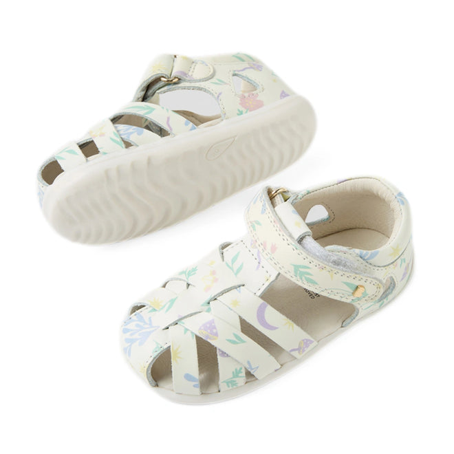 Two pairs of Bobux Step Up SU Tropicana II White Floral Closed Toe Sandals for toddlers are displayed at different angles. Each sandal features a white leather upper adorned with pastel floral and nature patterns, a closed toe, and an easy Velcro strap. The thick, textured sole provides excellent grip., 9420074810007, 9420074810014, 9420074810021