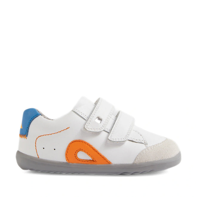 The Bobux SU Step Up Blaze Leather Toddlers Sneaker in White Orange features a white upper with a gray sole, orange and blue accents, a suede toe, and two hook-and-loop straps. Made from quick-drying leather, this stylish kid’s sneaker is displayed in a side view on a white background., 9420074848789, 9420074848796, 9420074848802, 9420074848819