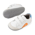 Introducing the Bobux SU Step Up Blaze Leather Toddlers Sneaker White Orange: These sneakers feature white leather uppers, gray soles, orange and blue accents, and a cozy gray inner lining. Made from quick-drying leather, they offer two hook-and-loop straps for easy fastening and a slightly textured sole—ideal for your toddler’s first walking adventures., 9420074848789, 9420074848796, 9420074848802, 9420074848819