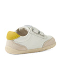 A small white and green Bobux Step Up SU Champ Sneaker First Walker, featuring convenient hook-and-loop straps and a durable rubber sole, positioned at an angle—perfect as first walkers or stylish kids’ leather sneakers., 9420074861795, 9420074861801, 9420074861818