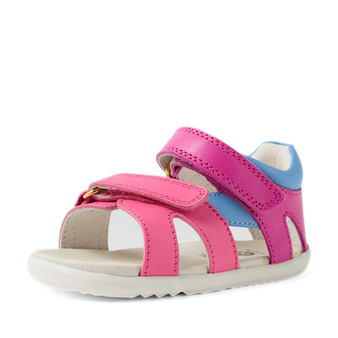 A rose bright pink children’s sandal, the Bobux SU Step Up Dune First Walker Open Toe Sandal, features an open toe design, adjustable Velcro straps for a secure fit, and a white sole., 9420074856128, 9420074856135, 9420074856142