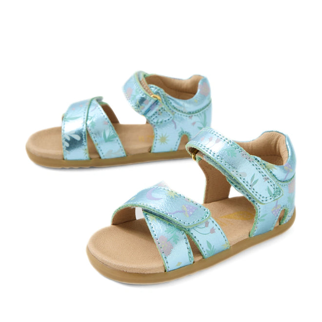 A pair of mint and metallic blue Bobux Step Up Flora First Walker sandals, featuring playful open toes, beige soles, and adjustable Velcro straps—these comfy leather shoes are perfect for little explorers. The shiny blue accents give a fresh twist to this classic children’s sandal design.