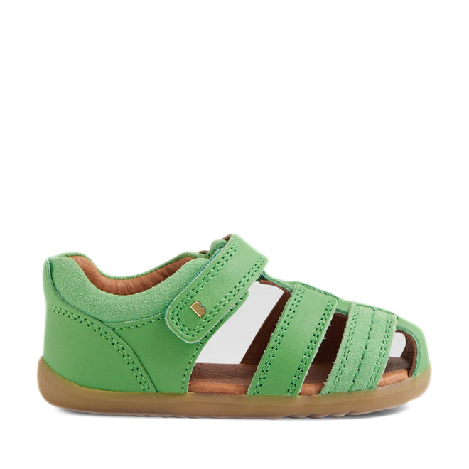 A single Bobux Step Up Sandal Roam Closed Toe Sandals in Retro Green for toddlers features a closed heel, open toe, three front straps, a Velcro strap closure, soft brown inner lining, and a light brown rubber sole—perfect first walkers shoes crafted for comfort and support., 9420074807205, 9420074807212, 9420074807229