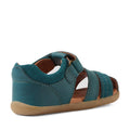 A Mediterranean green toddler sandal inspired by the Bobux Step Up Sandal Roam Closed Toe Sandals features a closed heel, open toe, adjustable strap, and flexible tan sole. Crafted in the style of classic leather sandals and viewed from the side and slightly behind, it offers comfort and practical design for little explorers., 9420074807144, 9420074807151, 9420074807168, 9420074807175