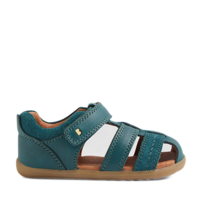 A Mediterranean green, closed-toe sandal for children with a velcro strap and tan rubber sole, shown in a side profile view against a white background—perfect for little ones who love the comfort and style of the Bobux Step Up Sandal Roam Closed Toe Sandals., 9420074807144, 9420074807151, 9420074807168, 9420074807175