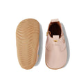 The Bobux Step Up Jodhpur Boot Cameo Rose Pink is a pair of unisex first walker boots in light pink leather, featuring a soft rubber sole and a small gold side detail. Shown from both top and bottom views on a white background., 9420068539471, 9420068539488, 9420068539495, 9420068539501