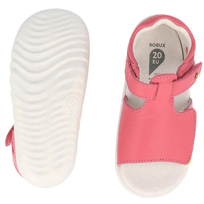 The Bobux Step Up Mirror Leather Sandal in Guava Bright Pink Rainbow is shown: one reveals the white textured sole, and the other displays the open-toe top with a strap. Insole marked BOBUX 20 EU—perfect first walker sandals for girls., 9420075704640, 9420075704657, 9420075704664, 9420075704671