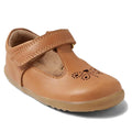 The Bobux Step Up T-Bar Rosie First Walker Shoe in Caramel Tan features a Velcro strap, rubber sole, and cute perforated cat face and heart design—perfect leather flats for your toddler’s first steps., 51165, 9420074850041, 9420074850058, 9420074850065