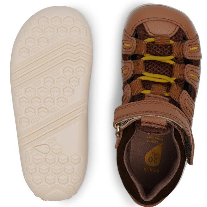The Bobux Step Up Summit Caramel Toffee Sandal 731609 for children is shown in brown and yellow leather, featuring a water-friendly, closed-toe design with a hook-and-loop strap and a hexagonal-patterned sole—ideal first walkers or action sandals., 9420071313891, 9420071313907, 9420071313914, 9420071313921