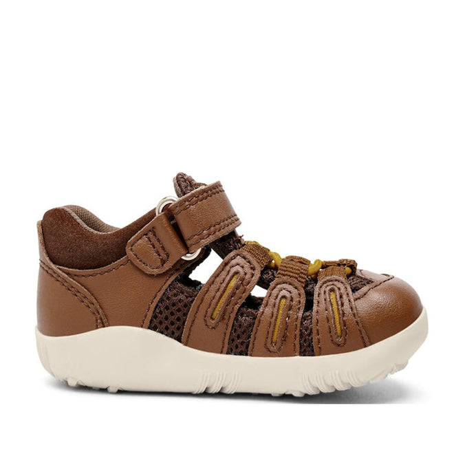 The Bobux Step Up Summit Caramel Toffee Sandal 731609 is a brown, water-friendly leather toddler sandal with closed toe, velcro strap, mesh sides, yellow elastic laces, and white rubber sole—ideal for first walkers and shown in profile on a plain background., 9420071313891, 9420071313907, 9420071313914, 9420071313921