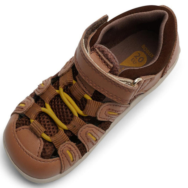 The Bobux Step Up Summit Caramel Toffee Sandal 731609 is a single brown closed-toe sandal for first walkers with mesh sides, velcro strap, yellow-accented elastic laces, and water-friendly leather, shown on a white background., 9420071313891, 9420071313907, 9420071313914, 9420071313921