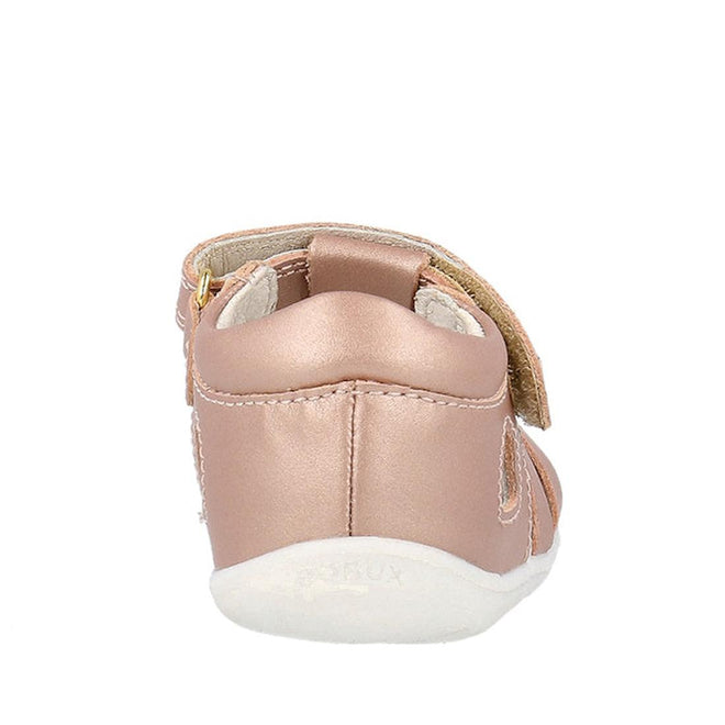 A rear view of the Bobux Step Up Tropicana II Rose Gold Sandal 732318, a small metallic rose gold baby sandal with a soft white sole, side hook-and-loop strap, and crafted from quick dry leather for comfort and durability., 9420075778528, 9420075772502, 9420075772175, 9420075772731