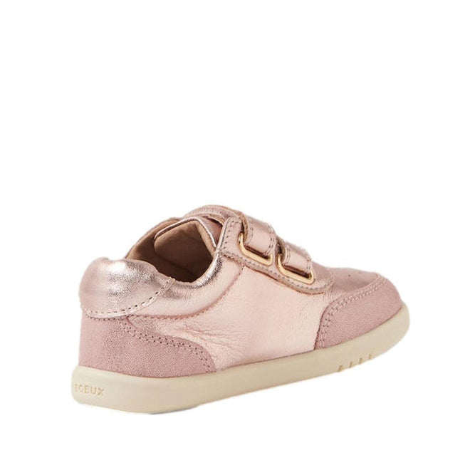 The Bobux Toddlers IWalk IW Champ Sneaker Rose Gold 650510 is a metallic pink unisex kids’ shoe with two hook-and-loop straps and a rubber sole, shown from the back-left side against a white background—a stylish pick for young Champ fans., 9420068552746, 9420068552753, 9420068552760, 9420068552777, 9420068552784