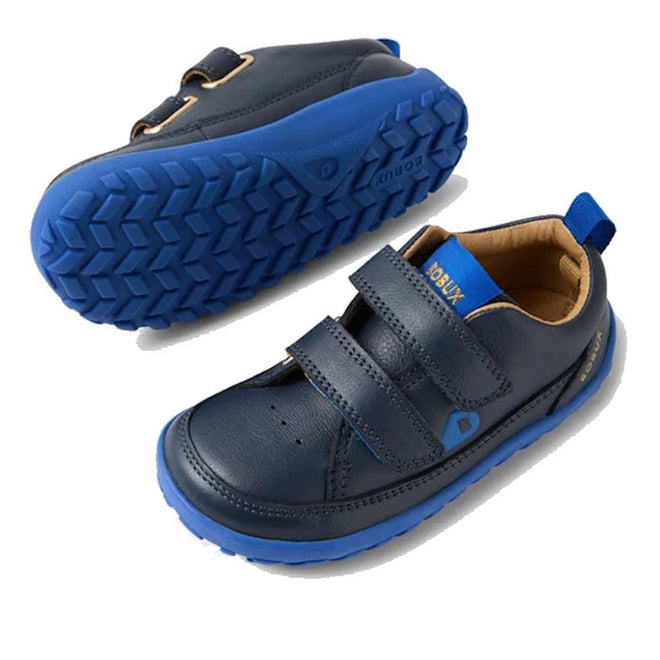 The Bobux IW Iwalk Dawn Toddlers Leather Sneaker Navy Alpha Barefoot is shown in navy blue with blue rubber soles and two velcro straps, displayed from the side and bottom on a white background., 52197, 9420068565289, 9420068565296, 9420068565302, 9420068565319