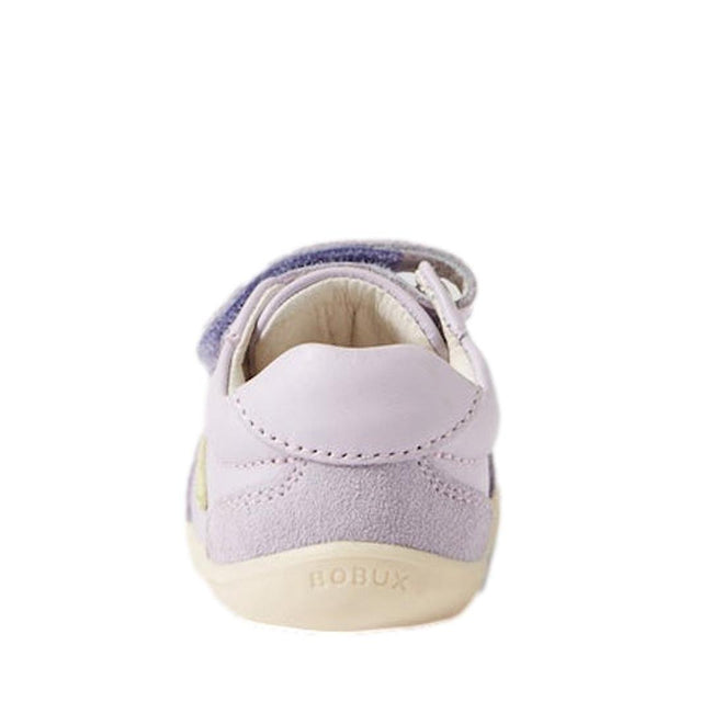 The Bobux Step Up SU Champ II Sneaker in Thistle Purple is a light purple and cream leather first walker for babies, shown from the back with BOBUX embossed on the sole and a visible Velcro strap at the top., 9420068552364, 9420068552371, 9420068552388