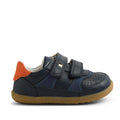 The Bobux SU Step Up Hunter Leather Toddlers Sneaker Navy features navy blue leather, two velcro straps, a tan rubber sole, toe perforations, and an orange heel accent—ideal kids’ sneakers or comfy first walker shoes., 9420074833853, 9420074833860, 9420074833877