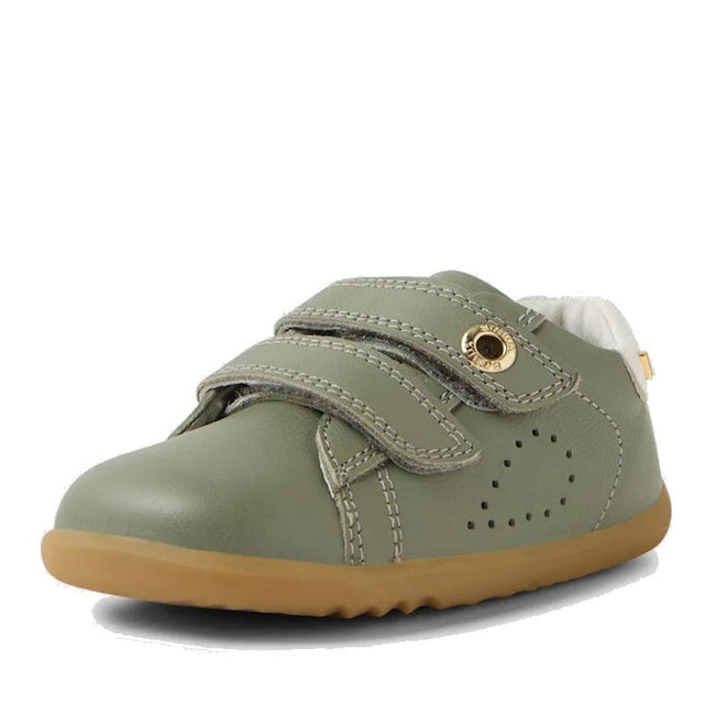 The Bobux SU Step Up Maverick Leather Toddlers Sneaker in Vetiver Green features a tan rubber sole, two adjustable straps, decorative stitching, and side perforations for breathability., 9420074836649, 9420074836656, 9420074836663
