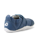 The Bobux XP Xplorer First Walking Shoes Go Vintage Indigo Blue features a blue leather upper, flexible white sole, velcro strap, and white B logo on the heel—perfect for little ones starting to walk. Shown from the back and side angles., 9420074842657, 9420074842664, 9420074842671, 9420074842688