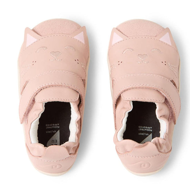 The Bobux XP Xplorer Purr First Walking Shoes in Cameo Rose Pink feature cat faces and ears, an adjustable strap, and white soles. The soft leather toddler shoes are shown side by side with toes facing upward., 9420074805959, 9420074805966, 9420074805973, 9420074805980