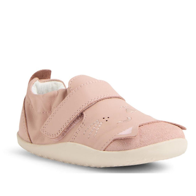 The Bobux XP Xplorer Purr First Walking Shoes in Cameo Rose Pink feature a soft pink design, white sole, large adjustable strap, and an embroidered cat face with whiskers and nose on the front—perfect for pre-walkers., 9420074805959, 9420074805966, 9420074805973, 9420074805980
