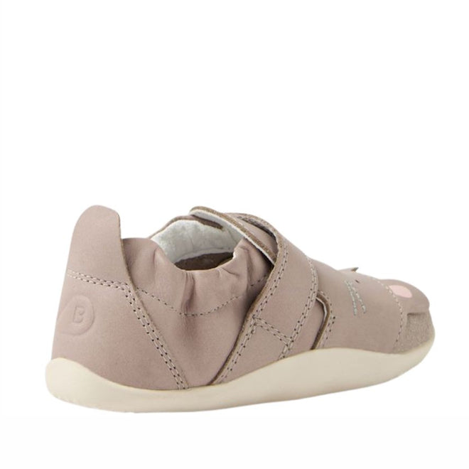 The Bobux XP Xplorer Squeaky Critters First Walking Shoes Taupe feature a light pink upper, velcro strap, elasticized heel, and soft off-white sole. Shown angled from the side and back, these are perfect as baby’s first walker shoes., 9420074805799, 9420074805805, 9420074805812, 9420074805829, 9420074805836
