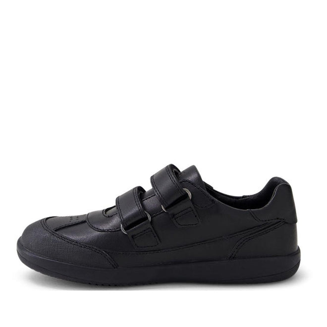 The Bobux Kid+ Black School Leather Shoe Traverse Trainer is a black, low-profile sneaker with two hook-and-loop straps and a textured sole, shown side-on against a plain white background., 9420075762978, 9420075762985, 9420075762992, 9420075763005, 9420075763012, 9420075763029, 9420075763036