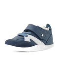 The Bobux Xplorer XP Chase Vintage Indigo Blue First Walker Crawler is pictured at an angle on a plain white background, featuring a blue design with white accents, faux laces, and a velcro strap. Ideal as first walking shoes, it boasts a supportive white sole and navy suede toe detail for added style and function., 9420074850638, 9420074850645, 9420074850652, 9420074850669