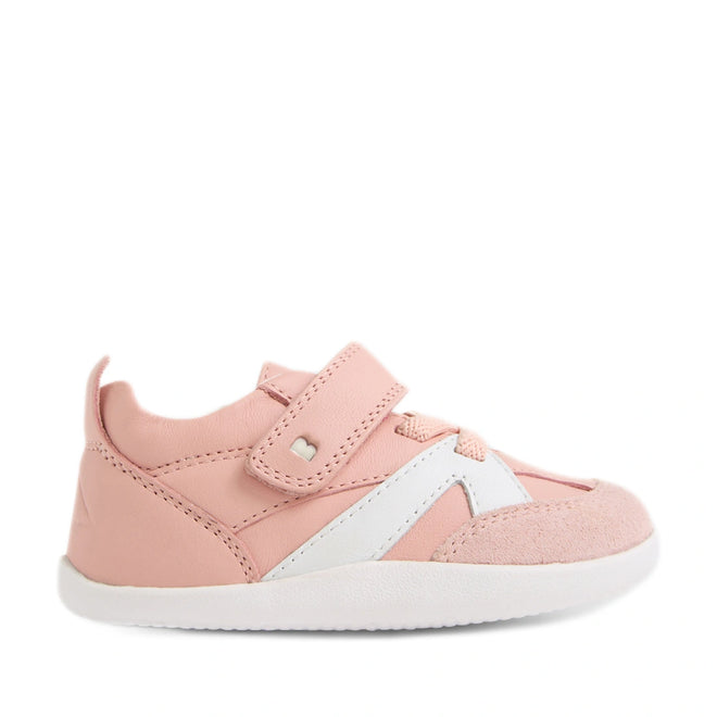 A single Bobux Xplorer XP Chase Ballet Pink First Walker Crawler shoe is shown in a side profile facing right against a white background, featuring light pink leather, a white sole, white accents, and a Velcro strap—perfect pre-walker footwear for little ones., 9420074850683, 9420074850690, 9420074850706, 9420074850713