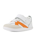 Bobux Xplorer XP Chase White Orange Peel First Walker Crawler—these white toddler sneakers with orange accents, a beige suede toe, white laces, and a Velcro strap are shown at an angle on a white background. Designed for comfort and support as pre-walker shoes, they feature a flexible sole perfect for little explorers., 9420074850737, 9420074850744, 9420074850751, 9420074850768