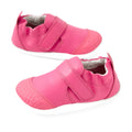 A pair of Bobux Xplorer XP Go Pink Lemonade First Walker Crawler shoes with white soles, elastic backs, and Velcro straps, displayed on a white background.