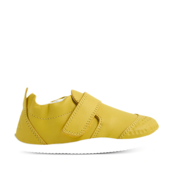 Introducing the Bobux Xplorer XP Go Mango Mint First Walker Crawler: a yellow soft leather baby shoe featuring a hook-and-loop strap, white sole, and textured toe—ideal for little ones taking their first steps—shown on a plain white background., 9420074809339, 9420074809346, 9420074809353
