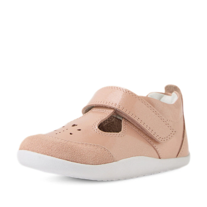 A single Bobux XP Explorer Rue First Walker Sandal in Camo Rose Pink, featuring a velcro strap, white sole, and small heart-shaped cutouts on the front, is photographed against a white background., 9420074851246, 9420074851253, 9420074851260