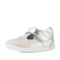 The Bobux XP Explorer Rue First Walker Sandal in Silver is a small toddler shoe featuring a white sole, Velcro strap, and beige suede toe cap. Perfect for first walkers, it boasts a rounded toe and perforated detailing on the front to enhance comfort and style., 9420074851192, 9420074851208, 9420074851215