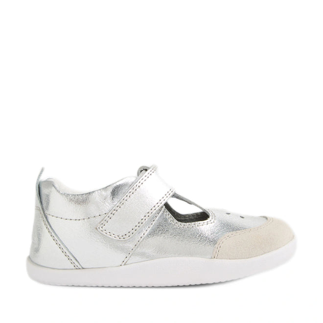 The Bobux XP Explorer Rue First Walker Sandal in Silver features a metallic finish, a white sole, a beige toe cap, and a convenient hook-and-loop strap—ideal as stylish baby shoes or comfortable first walking shoes., 9420074851192, 9420074851208, 9420074851215