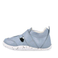 The Bobux XP Explorer Beau First Walker Sandal 502303 is a light blue closed-toe toddler shoe with cut-out sides, a white speckled flexible sole, and a hook-and-loop strap for easy fastening—perfect for learning to walk., 9420075784628, 9420075784994, 9420075783652, 9420075783188