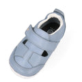 The Bobux XP Explorer Beau First Walker Sandal 502303 is a light blue learning-to-walk shoe with velcro strap, cutout design, soft white flexible sole and inner lining, shown from above on a white background., 9420075784628, 9420075784994, 9420075783652, 9420075783188